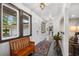 Bright entryway features stylish slate floors, an wooden bench, and views into adjacent living spaces at 103 Wofford Ln., Conway, SC 29526