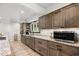 Gourmet kitchen featuring granite countertops, stainless steel appliances, and wood cabinets and a view to the back yard at 103 Wofford Ln., Conway, SC 29526