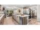 Well-equipped kitchen featuring an island with a cooktop, stainless steel appliances, and an adjacent dining area at 103 Wofford Ln., Conway, SC 29526
