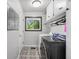Well-lit laundry room featuring modern washer and dryer on patterned floor at 103 Wofford Ln., Conway, SC 29526