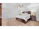 Bright bedroom with a wooden bed frame, hardwood floors, and large closet space at 103 Wofford Ln., Conway, SC 29526