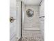 Modern shower features river rock floor, sitting bench, and unique window for natural light at 103 Wofford Ln., Conway, SC 29526