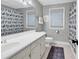 Bathroom featuring striped wallpaper, dual windows, and a toilet at 1072 Chelsey Circle, Conway, SC 29526