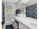Stylish bathroom with striped walls, vanity with drawers, and floral shower curtain at 1072 Chelsey Circle, Conway, SC 29526