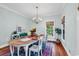 Elegant dining room featuring hardwood floors, stylish lighting, and ample seating for a cozy atmosphere at 1072 Chelsey Circle, Conway, SC 29526