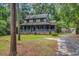 Charming two-story home with a welcoming front porch and beautifully wooded surroundings, inviting relaxation at 1072 Chelsey Circle, Conway, SC 29526