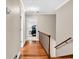 Hallway with wood floors leading to a bedroom at 1072 Chelsey Circle, Conway, SC 29526
