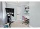 Bright office space with a desk, floating shelves, and home gym equipment at 1072 Chelsey Circle, Conway, SC 29526