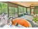 Cozy sunroom with screened windows, wood ceiling, and outdoor views at 1072 Chelsey Circle, Conway, SC 29526
