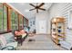 Bright sunroom features lots of natural light, wood-look flooring, and comfortable seating at 1072 Chelsey Circle, Conway, SC 29526
