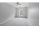 Bedroom featuring neutral walls, gray carpet, one window, and ceiling fan at 1120 Fairway Ln. # 1120, Conway, SC 29526