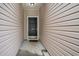 Inviting entryway to 1120, featuring a black front door and neutral siding at 1120 Fairway Ln. # 1120, Conway, SC 29526