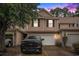 Charming two-story townhome with black shutters, a white garage door, and driveway with a black truck parked at 1120 Fairway Ln. # 1120, Conway, SC 29526