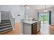 Bright kitchen featuring a sink and counter area with modern appliances and a view to the outdoor patio at 1120 Fairway Ln. # 1120, Conway, SC 29526