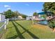Lush backyard with a hammock, picnic table, storage, and a white fence, creating a serene retreat at 1145 Forest Dr., North Myrtle Beach, SC 29582