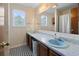 A bathroom featuring double sinks, a large mirror and black and white flooring at 1145 Forest Dr., North Myrtle Beach, SC 29582