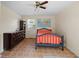 Cozy bedroom features a unique dresser and a world map hanging above the bed at 1145 Forest Dr., North Myrtle Beach, SC 29582