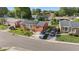 Aerial view of a brick home featuring solar panels and ample parking at 1145 Forest Dr., North Myrtle Beach, SC 29582