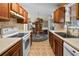 Open kitchen area provides ample cabinet space and natural light from a window at 1145 Forest Dr., North Myrtle Beach, SC 29582