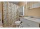 Compact bathroom featuring a white vanity, toilet, and shower with a decorative curtain for a fresh, clean look at 12 Century St. # 12, Myrtle Beach, SC 29577