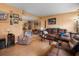 Cozy living room with warm-toned walls, comfortable seating, and a laminate floor flowing into the dining area at 12 Century St. # 12, Myrtle Beach, SC 29577