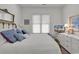 Comfortable bedroom featuring a bed, dresser, and plenty of natural light at 1208 Trisail Ln, North Myrtle Beach, SC 29582