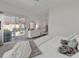 This bright bedroom offers a patio exit, a decorative dresser, and plush decor and furnishings at 1208 Trisail Ln, North Myrtle Beach, SC 29582