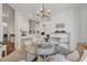 Bright dining area with a chandelier adjacent to the kitchen at 1208 Trisail Ln, North Myrtle Beach, SC 29582