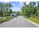Neat community entrance with manicured lawns and colorful flower beds at 1208 Trisail Ln, North Myrtle Beach, SC 29582
