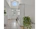 Bright entryway with tile floors, a decorative front door, and large transom window at 1208 Trisail Ln, North Myrtle Beach, SC 29582