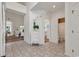 Open-concept entryway with tile flooring, leading to the living room and bathroom at 1208 Trisail Ln, North Myrtle Beach, SC 29582