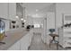 Galley-style kitchen featuring lots of cabinet space with open access to dining area at 1208 Trisail Ln, North Myrtle Beach, SC 29582