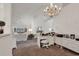 Bright, open living room with white decor, a chandelier, and vaulted ceilings at 1208 Trisail Ln, North Myrtle Beach, SC 29582