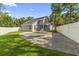 Fenced backyard featuring a hardscape, grass, palm tree, and privacy fence at 1331 Bermuda Ct., Surfside Beach, SC 29575