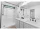 Bathroom featuring a dual sink vanity, subway tile shower, and modern fixtures at 1331 Bermuda Ct., Surfside Beach, SC 29575