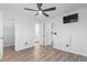 This bright bedroom offers luxury vinyl plank flooring, ceiling fan, and easy access to the bathroom and kitchen at 1331 Bermuda Ct., Surfside Beach, SC 29575
