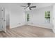 Sun-filled bedroom with luxury vinyl plank flooring, modern ceiling fan and large windows for ample natural light at 1331 Bermuda Ct., Surfside Beach, SC 29575