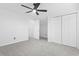 The carpeted bedroom features a ceiling fan and closet, with easy access to the hall and attic storage at 1331 Bermuda Ct., Surfside Beach, SC 29575