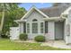 Close up of the front of the home showing the windows and front entrance at 1331 Bermuda Ct., Surfside Beach, SC 29575