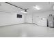 Garage with laundry, water heater, tv, epoxy floors, mini-split AC, and a utility box at 1331 Bermuda Ct., Surfside Beach, SC 29575