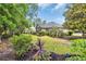 Beautiful landscaped yard with mature trees and plantings that add to the curb appeal of this lovely home at 139 Olde Canal Loop, Pawleys Island, SC 29585