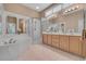 Well-lit bathroom with double vanity, soaking tub, and glass-enclosed shower at 139 Olde Canal Loop, Pawleys Island, SC 29585