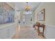 Welcoming foyer featuring a chandelier, elegant decor, and light hardwood floors at 139 Olde Canal Loop, Pawleys Island, SC 29585