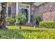Inviting front porch with decorative ferns and well-maintained landscaping at 139 Olde Canal Loop, Pawleys Island, SC 29585