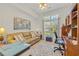 Well-lit home office featuring a comfortable sofa, desk, and ample storage at 139 Olde Canal Loop, Pawleys Island, SC 29585