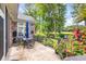 Outdoor patio with dining table and chairs overlooking landscaped yard and golf course at 139 Olde Canal Loop, Pawleys Island, SC 29585