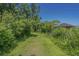 Tranquil walking path lined with lush greenery leading to a charming gazebo and natural setting at 139 Olde Canal Loop, Pawleys Island, SC 29585
