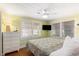 Bright bedroom with a queen bed, flat screen tv, dresser and serene green walls at 1416 Edge Dr., North Myrtle Beach, SC 29582