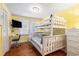 ' room featuring a built-in desk, bunk beds, wood floor, and a bright yellow wall at 1416 Edge Dr., North Myrtle Beach, SC 29582