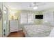 Bright bedroom with a queen bed, flat screen tv, dresser and serene green walls at 1416 Edge Dr., North Myrtle Beach, SC 29582